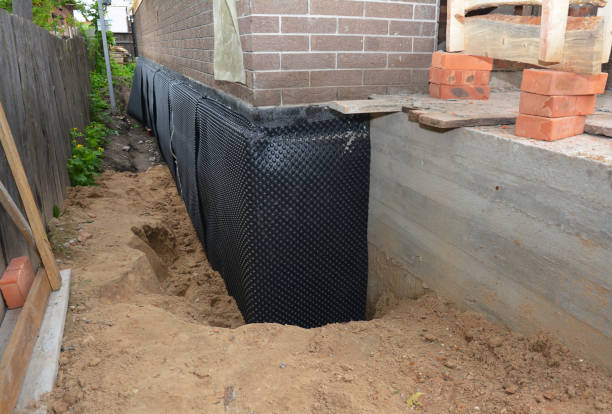 SJ Waterproofing Pros technician performing targeted Exterior Waterproofing assessment in Estell Manor, NJ